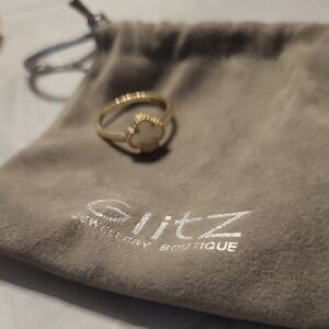 Gold and White Solitaire Ring with Textured Band